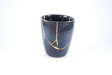 Broken black cup, broken heart representation