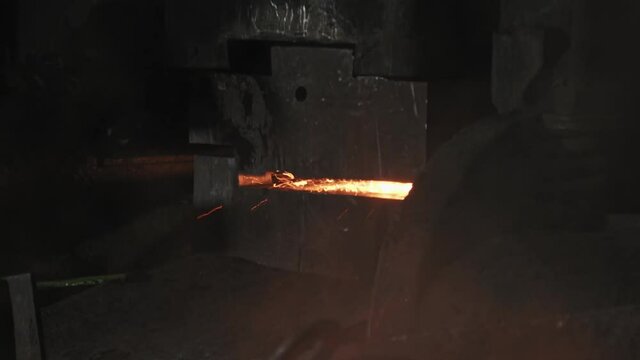 Process of work of hydraulic press forging and shaping piece of red heated piece of iron or steel