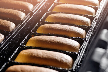 Baked breads on form conveyor food automatic production line bakery from hot oven