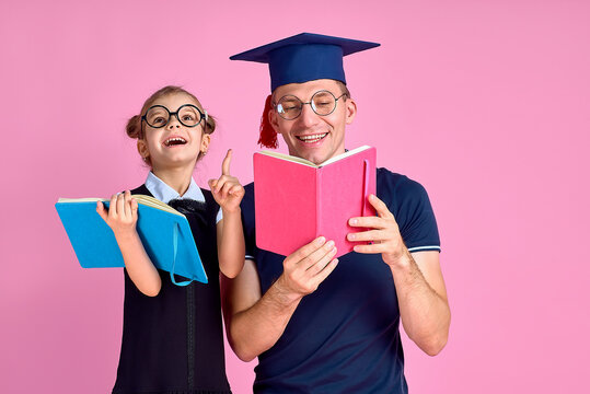 Man in academic hat holding book, study together with cute prete