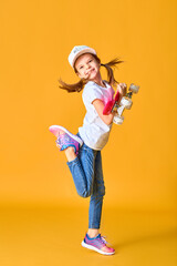 Active and happy. Kid having fun with penny board. Child smiling