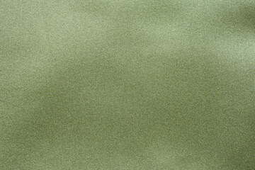 Green fabric texture background close up