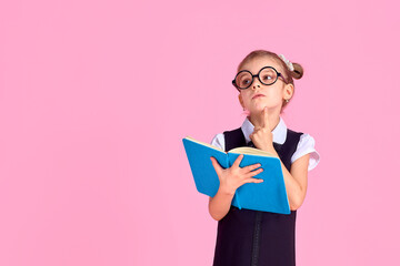 primary school girl in uniform, round glasses without lenses hol