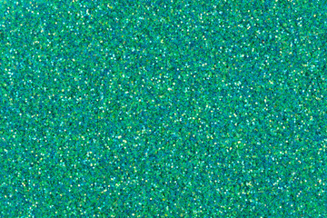 New stylish texture, holographic glitter background in greeny tone.