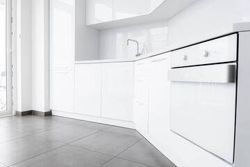 white modern kitchen with built-in appliances