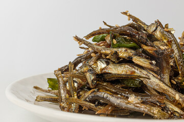 Stir-fried anchovies on white background