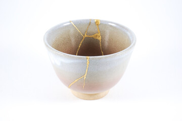 Kintsugi pink teacup, antique Japanese pottery restored with gold scars