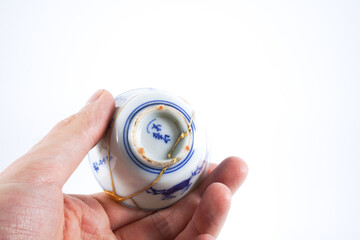 Japanese blue and white decorated sake cup, kintsugi pottery with real gold