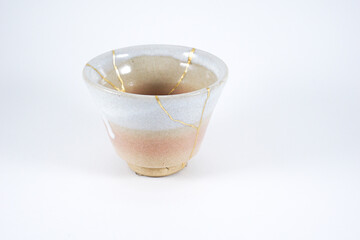 Kintsugi pink teacup, antique Japanese pottery restored with gold scars