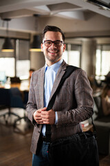 Businessman in office. Portrait of smiling businessman in suit.