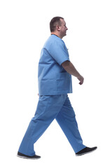 Fototapeta premium confident male paramedic striding forward. isolated on a white background.