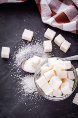 sugar refined on a dark stone background