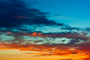 Naklejka na ściany i meble Beautiful clouds in the summer sunset sky
