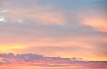 Fototapeta na wymiar Pink clouds in the beautiful summer sunset sky (background)