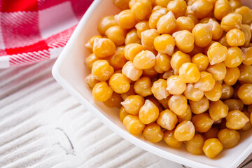 boiled chickpeas on a white wooden rustic background