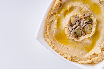 traditional turkish hummus on a white acrylic background