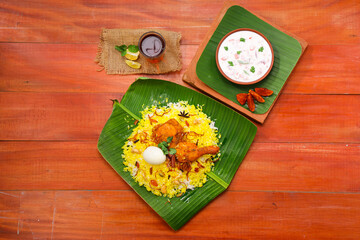 Chicken dum  Biryani_Indian Biriyani_wooden background