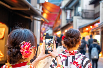 Young girls taking a mobile photo