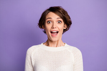 Portrait of impressed lady hairstyle open mouth staring wear pullover isolated on purple color background