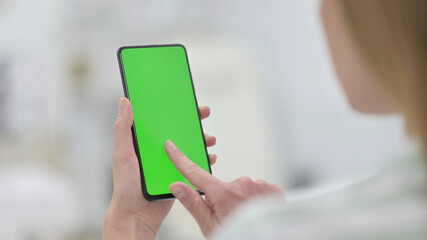 Woman using Smartphone with Green Key Chroma Screen 