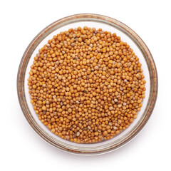 Glass bowl with mustard seeds isolated on white backdrop with clipping path embedded