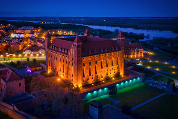 Teutonic castle in Gniew town illuminated at night, Poland
