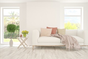 White living room with sofa and summer landscape in window. Scandinavian interior design. 3D illustration