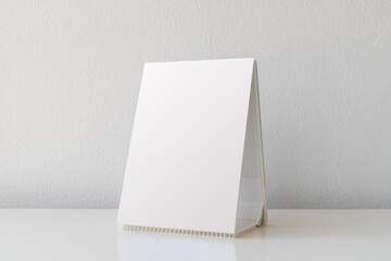 Mock up Label the blank menu frame in Bar restaurant. Stand for booklet with white sheet paper...