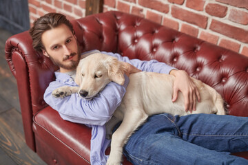 relaxing guy and Retriever