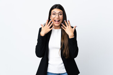 Business woman over isolated white background with surprise facial expression