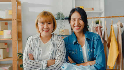 Portrait of young Asia women fashion designer feeling happy smile, arms crossed and looking to...