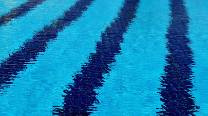 Abstract pattern of pool water formed by strong wind