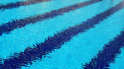 Abstract pattern of pool water formed by strong wind