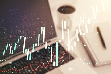 Multi exposure of abstract financial graph on laptop background, financial and trading concept