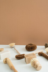 Fototapeta na wymiar set of zero waste bamboo brushes for dishwashing in minimalistic style
