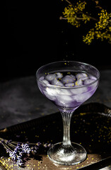 Lavander coctail on dark and moody background.
