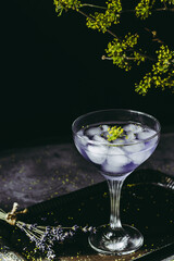 Lavander coctail on dark and moody background.