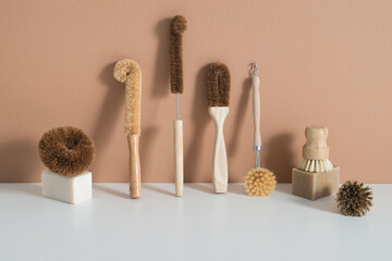 Fototapeta na wymiar set of zero waste bamboo brushes for dishwashing in minimalistic style