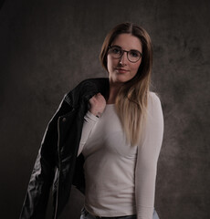 Attractive young woman poses for the camera - studio photography