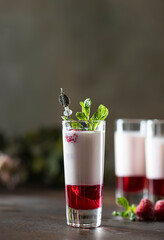 Shot cocktails with raspberry, vanilla liqour, vodka. Fresh summer shots for party.