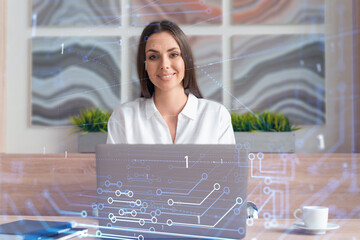 Attractive businesswoman in white shirt at workplace working with laptop to optimize development by...