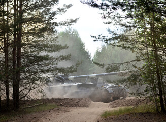 Military tank and military equipment in the forest