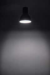 a shining levitating hanged ceiling lamp without electric wire  with dark blue tone dirty concrete...