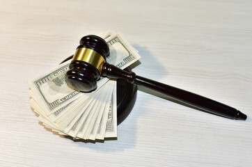 Judge hammer and bundles of dollars. Justice in courtroom. Mallet of judge on law theme and legal...