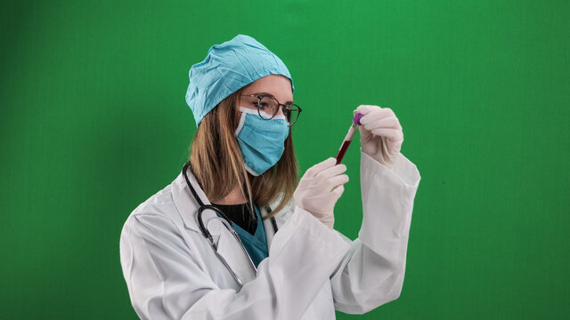 Female doctor examines a blood sample - studio photography