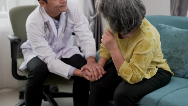 Elderly patients have worry and young doctor touch to encourage
