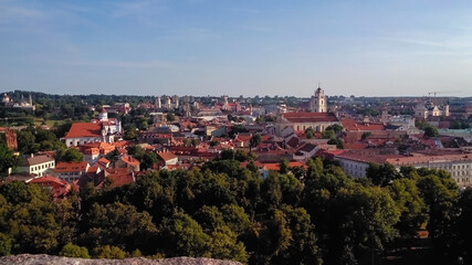 Fototapeta premium Panorama of the old city. Aerial view from Mount Gedymin to the historic old part of the city of Vilnius in Lithuania. Summer time. Horizontal photo. 
