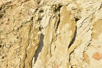 Land structure in open pit mining. Ground background in quarry. Rock texture during earthworks. Sand background and Earth's crust.