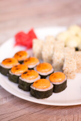 Plate with delicious sushi close up