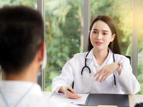 A Female Doctor Or Nurse Is Talking Or Interview A Male Patient, Ideas For Healthcare Concepts.